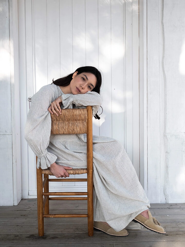 Girl sitting down on chair